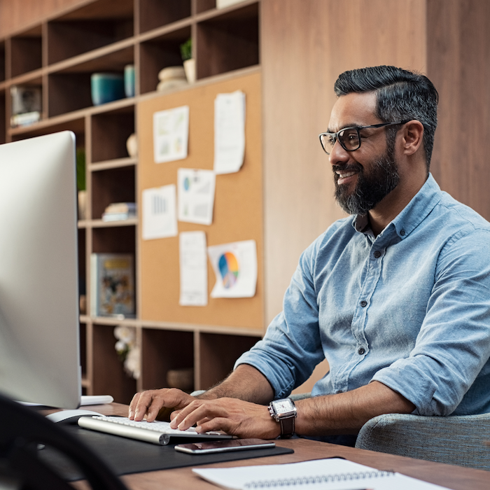 Man sits in home office, working